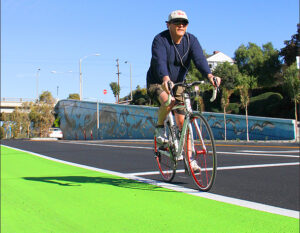 A cyclist rides along the new green bike lane on Ocean Park Boulevard. (File photo)