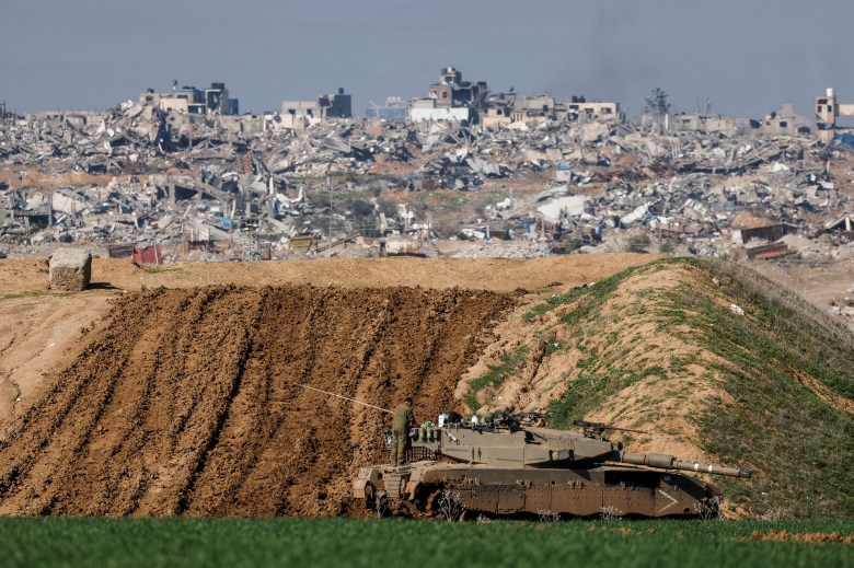 An Israeli soldier stands on a tank in Gaza, amid the ongoing conflict between Israel and the Palestinian Islamist group Hamas, as seen from Israel Jan. 16, 2024. Photo by Amir Cohen, REUTERS