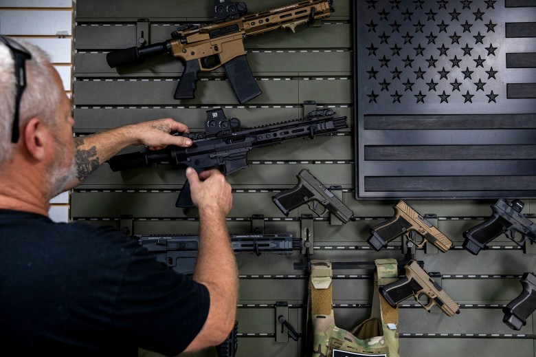 Gunsmith Don Gregory shows off two new single-action firearms recently released by Juggernaut Tactical in Orange on Thursday, Sept. 21, 2023. Photo by Alisha Jucevic for CalMatters