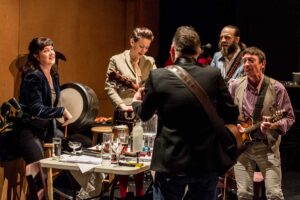 (From left) Annie Grace, Melody Grove (Prudencia),Paul McCole, Alasdair Macrae, David McKay performing on instruments for The National Theatre of Scotland's 'The Strange Undoing of Prudencia Hart.' (Photo courtesy Ben Gibbs)