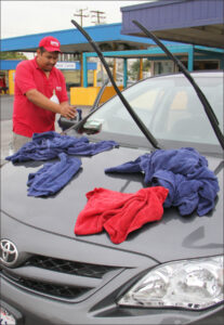 A worker towels off a car at the Wilshire West Carwash on Wednesday. (Photo by Daniel Archuleta)