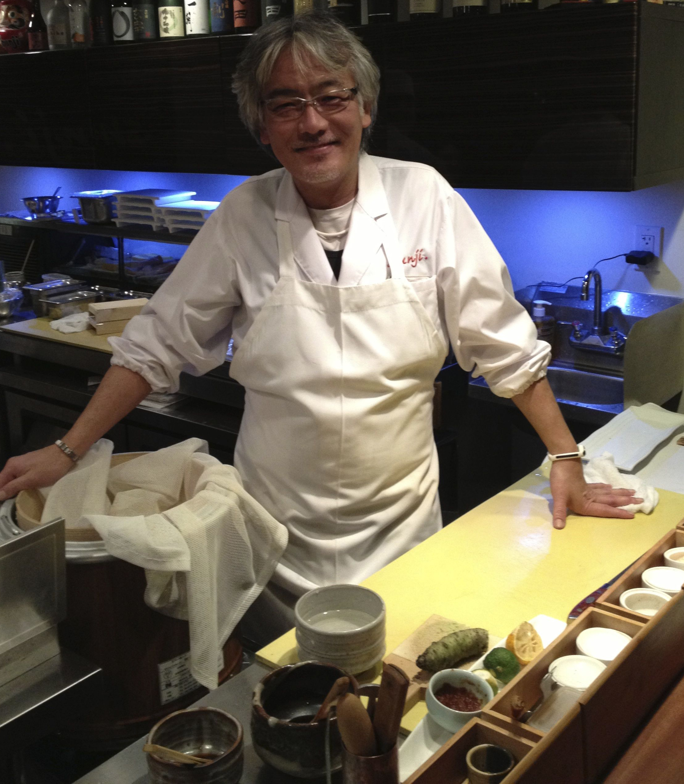 Head chef Shunji Nakao takes a short break to pose for a picture.  (Photo by Merv Hecht)