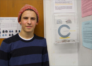 Justin Sardo stands by one of his Pocket Change boxes at Santa Monica High School. (File photo)