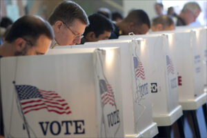 Voters cast ballots at City Hall during November's election. (File photo)