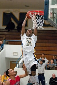 SKY: Santa Monica High School's Jordan Mathews rises up for a dunk against Morningside on Tuesday at home. Samohi won the game, 79-49. The win improves the Vikings to 8-1 in league. (Photo by Morgan Genser)