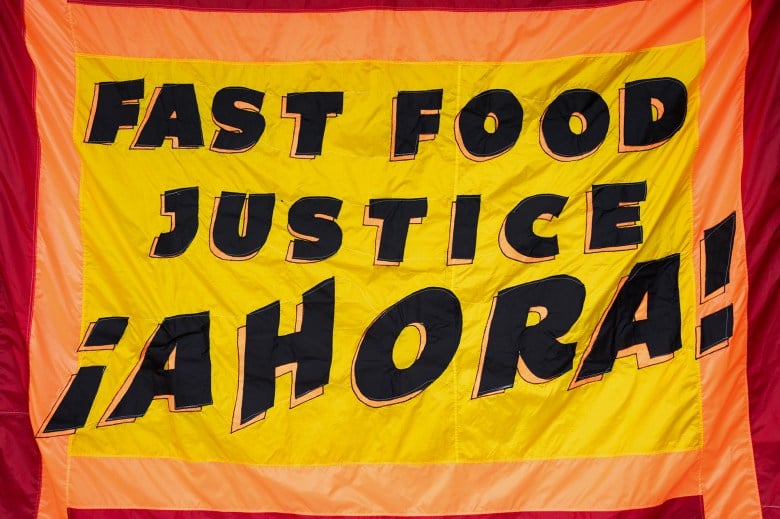 A banner outside the California Fast Food Workers Union SEIU Membership Launch Event in Los Angeles on Feb. 9, 2024. Photo by Jules Hotz for CalMatters