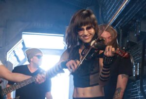 PLAYING ALONG: Violinist Christine Wu on set during Billy Ray Cyrus' ‘Achy Breaky 2' music video shoot at Laurel Canyon Stages on Jan. 7. (Photo courtesy Adrian Sidney/Picturegroup)