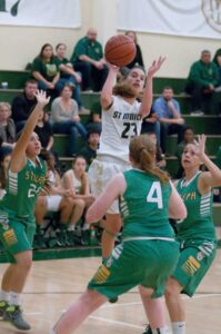 GETTING ONE OFF: St. Monica's Gloria Scipioni (center) goes up for a shot against St. Joseph at home on Wednesday. (Morgan Genser editor@www.smdp.com)