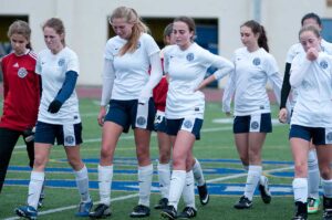 Teammates from the Santa Monica High School girls varsity soccer team  walk off the soccer field upset after loosing 3-0 to Lancaster High School a at Santa Monica High School on Friday February 28th 2014 as Samo hosted Lancaster in the Division 4 Southern Section girls playoffs and lost 3-0 