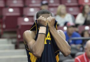 Samohi's Nuwriyl Williams covers his face after the Vikings lost in the state basketball finals on Friday. (Photo by Charles McDonald)