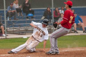 HE'S IN THERE: Santa Monica High School's Tomas Gutierrez slides into home plate following a Hawthorne wild pitch on Tuesday afternoon at home. Samohi went on to win the Ocean League game, 5-4. (Morgan Genser editor@www.smdp.com)