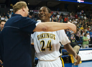 Samohi head coach James Hecht (left) and guard Jordan Mathews celebrate after winning the CIF State Regional final against Loyola on March 16. (Photo by Paul Alvarez Jr.)