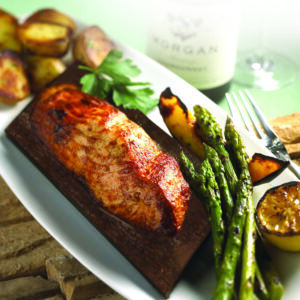 Seasons 52 chegs use ceder planks to help enhance the flavor of salmon without adding any additional calories to the dish. (Photo courtesy Seasons 52)