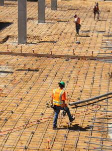 A crew works Wednesday on the foundation of High Place East, an affordable housing development. (Photo by Daniel Archuleta)