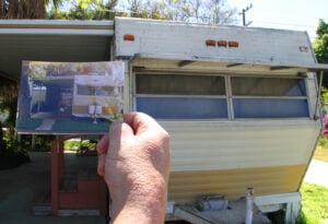 Village Trailer Park resident 'Bill' holds up a picture of his trailer from 1986. (Photo by Daniel Archuleta)