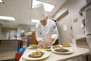 Gabriel Gomez, executive chef, prepares antibiotic-free menu items at Ronald Reagan UCLA Medical Center.