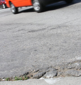 A van streaks through the intersection of Lincoln Boulevard and Michigan Avenue on Monday. Lincoln is in line to see a repaving to fix the aging roadway. (Photo by Daniel Archuleta)