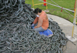 A worker inspects 'Chain Reaction' last year. (File photo)