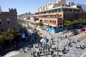 The bustling Third Street Promenade, with its combination of restaurants, retail and street performers, helped Santa Monica make the list of most exciting suburbs. (File photo)