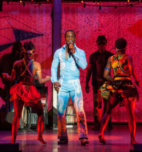 IN MOTION: Adesola Osakalumi (center) and the cast of ‘Fela!' do their thing on stage. (Photo courtesy Sharen Bradford)