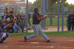 BIG CUT: Santa Monica's Rudy Olmedo swings at a pitch against Beverly Hills on Tuesday at La Cienega Park. (Morgan Genser editor@www.smdp.com)