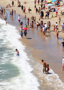 SPLISH SPLASH: Thousands flocked to Santa Monica State Beach on Thursday for a little relief from the record-breaking heat. Thursday was another in a string of record temps. (Daniel Archuleta daniela@www.smdp.com)