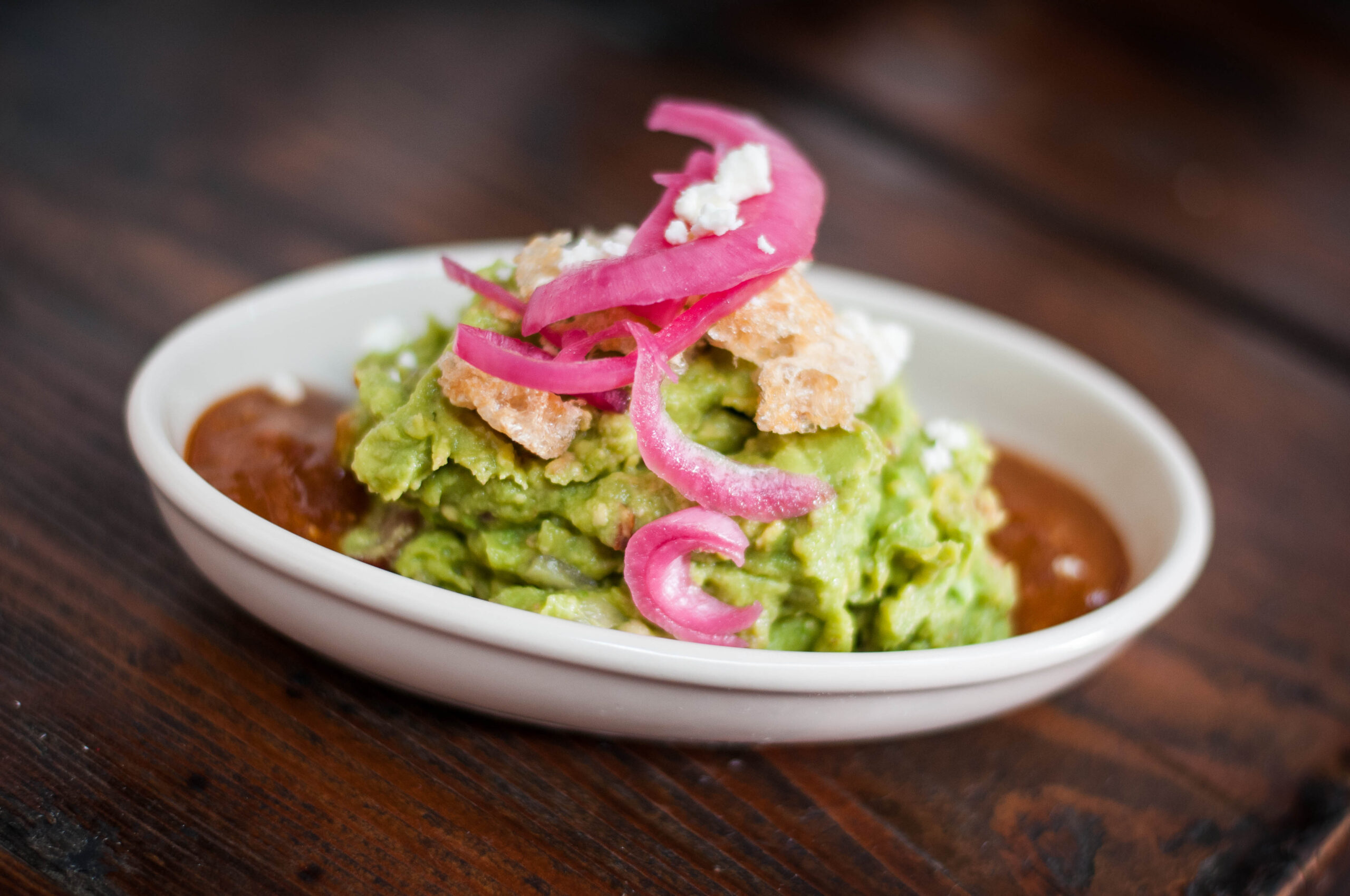 Nueske's apple-smoked bacon and chicharrones mingling with fresh avocados make up Tinga's bacon guacamole. (Photo courtesy Tinga)