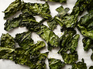 Instead of reaching for the Cool Ranch Doritos, try a healthier option by baking some nutritious kale chips with some olive oil and sea salt or create your own marinade. (Photo courtesy Google Images)