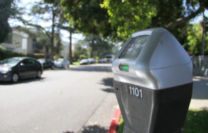 paying up: City Hall's Planning Department is considering a pilot program expanding the use of parking meters on select residential streets near major arteries like this one on 14th Street. (Photo by Daniel Archuleta)