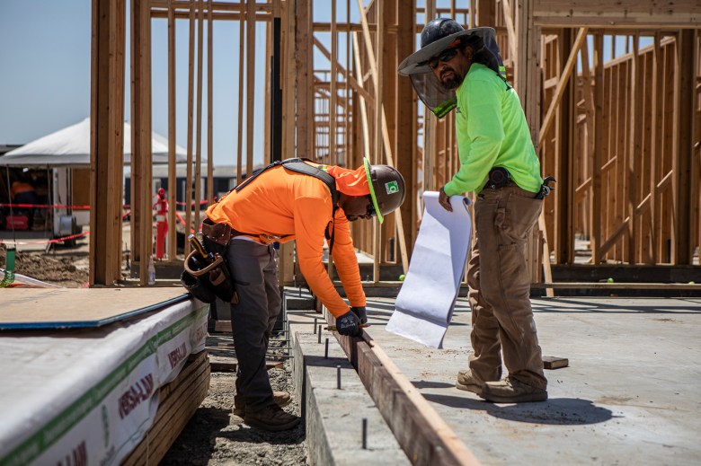 Construction workers on site of a tiny homes village in Goshen on June 2, 2023. Poverty rose to 14% among construction workers this spring. Photo by Larry Valenzuela, CalMatters/CatchLight Local