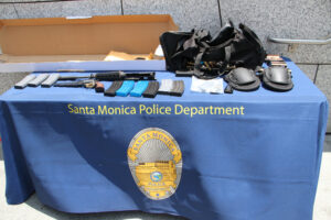 Weapons, ammunition and ammo clips found in a black bag carried by the suspect during the shooting rampage were put on display for reporters by the Santa Monica Police Department on Saturday during a press conference outside the Public Safety Facility.