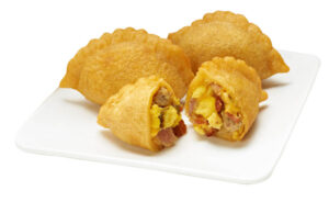 7-Eleven stores introduce 'Breakfast Empanada Bites' to capitalize on the snacking trend. The miniature pastries filled with eggs, cheese, bacon, smoked ham and sausage sell at a value price of three for $1 at participating locations. (Photo courtesy 7-Eleven)