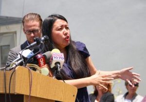 Community activist Irma Carranza discusses the Cradle to Career initiative during a press conference introducing the new Youth & Family Violence Prevention Fund on Tuesday at Virginia Avenue Park. (Photo by Daniel Archuleta)