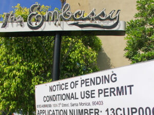 POSTED: A notice regarding a proposed conditional use permit is displayed in front of Palihouse. (File photo)