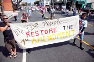 Members of the Restore the Fourth movement march along Main Street Thursday as part of the annual Fourth of July parade. (Brandon Wise brandonw@www.smdp.com)