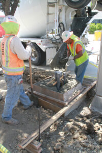 A crew works on a new electrical service along the route of the forthcoming Expo Light Rail Line on Tuesday. (Daniel Archuleta)