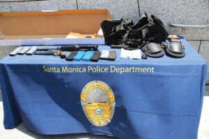 SHOCKING DISPLAY: Weapons, ammunition and ammo clips found in a black bag carried by John Zawahri during a shooting rampage were put on display for reporters by the Santa Monica Police Department during a June press conference outside the Public Safety Facility. (File photo)