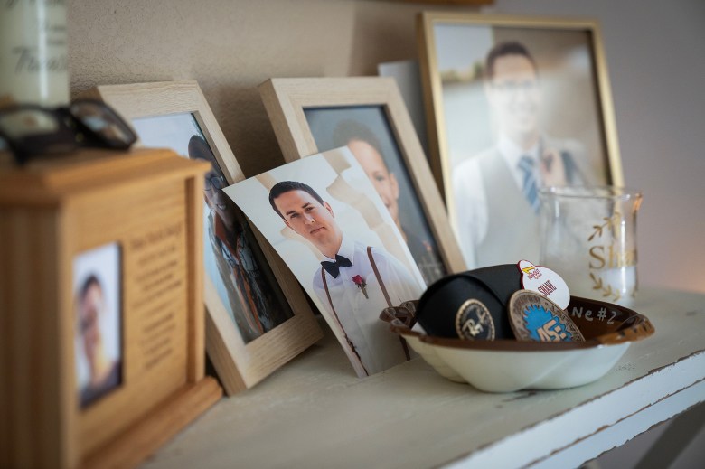 Photos and belongings of Shane Balogh on display on a table at his parent's home in Garden Grove on July 19, 2023. Photo by Julie A Hotz for CalMatters