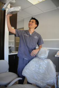 Dentist Peter Pham checks his examination room's equipment earlier this week at his office on Santa Monica Boulevard. (Daniel Archuleta daniela@www.smdp.com)