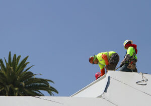 A construction crew works on the roof of the forthcoming Pico Library on Thursday. (Daniel Archuleta daniela@www.smdp.com)