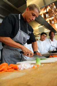 CHOP, CHOP: St. Joseph Center's Chef D. Brandon Walker shows off his knife skills. (Daniel Archuleta daniela@www.smdp.com)