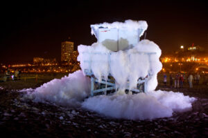 FOAMY: C√©leste Boursier-Mougenot's 'Shaped Noise' at the 2010 Glow event. The foam was produced according to visual signals that were picked up by four video cameras situated in the adjacent parking lot. The data was translated into signals controlling the amount of foam produced, and stimulated an audio response broadcast in speakers placed within the tower structure. (William Short; Courtesy City of Santa Monica)