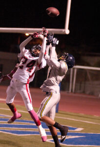 Samohi wide receiver De'Jai Whitaker (right) and Morningside defensive back Joseph Bradshaw battle for a pass near the end zone on Friday at Corsair Field. (Morgan Genser editor@www.smdp.com)