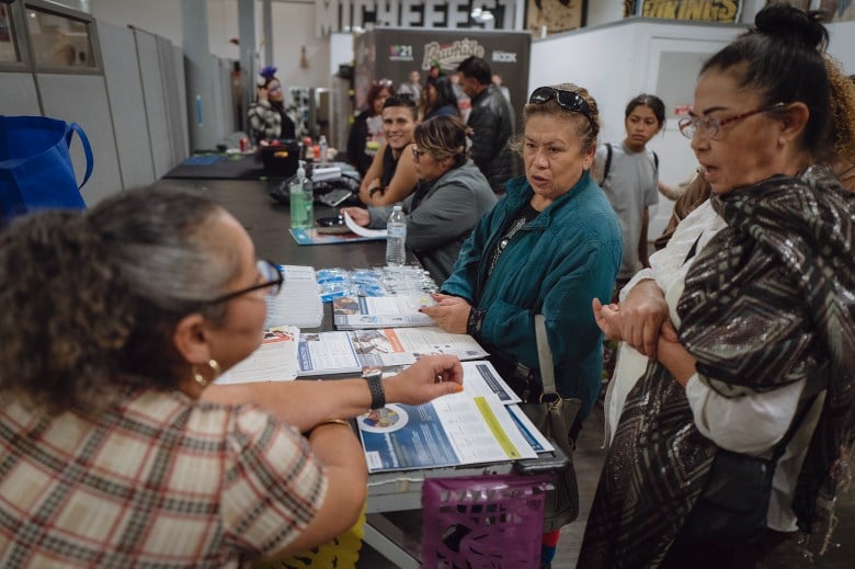 Organizers inform attendees about their rights as voters and the available resources within the community in Tulare on Nov. 1, 2023. Photo by Zaydee Sanchez for CalMatters.