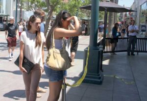 NOT OPEN: Visitors to the Third Street Promenade look at Yankee Doodles after a July fire. (File photo)