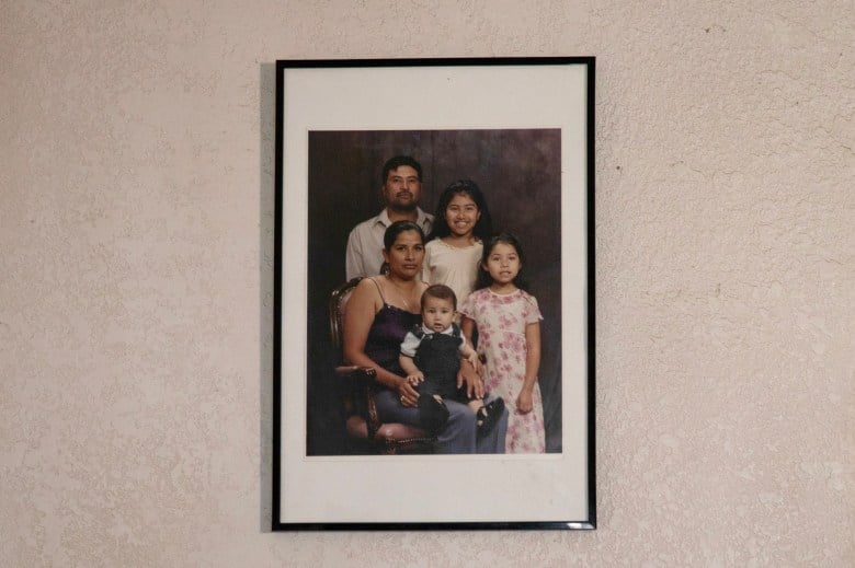 A framed photo of Maria Vela and her family at their home in east Los Angeles on Dec. 1, 2023. Vela and her family will be evicted from their home on Christmas Eve after living in the property for more than 20 years. Photo by Adriana Heldiz, CalMatters