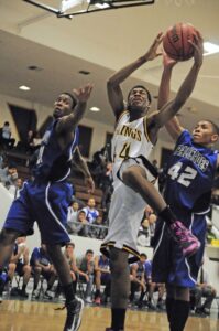 Samohi's Nuwr'iyl Williams goes for a layup in between two Palisades High defenders on Monday in the first night of pool play of the Fourth Annual 'The Tournament' held at Samohi. The Vikings won 63-55. (Morgan Genser editor@www.smdp.com)