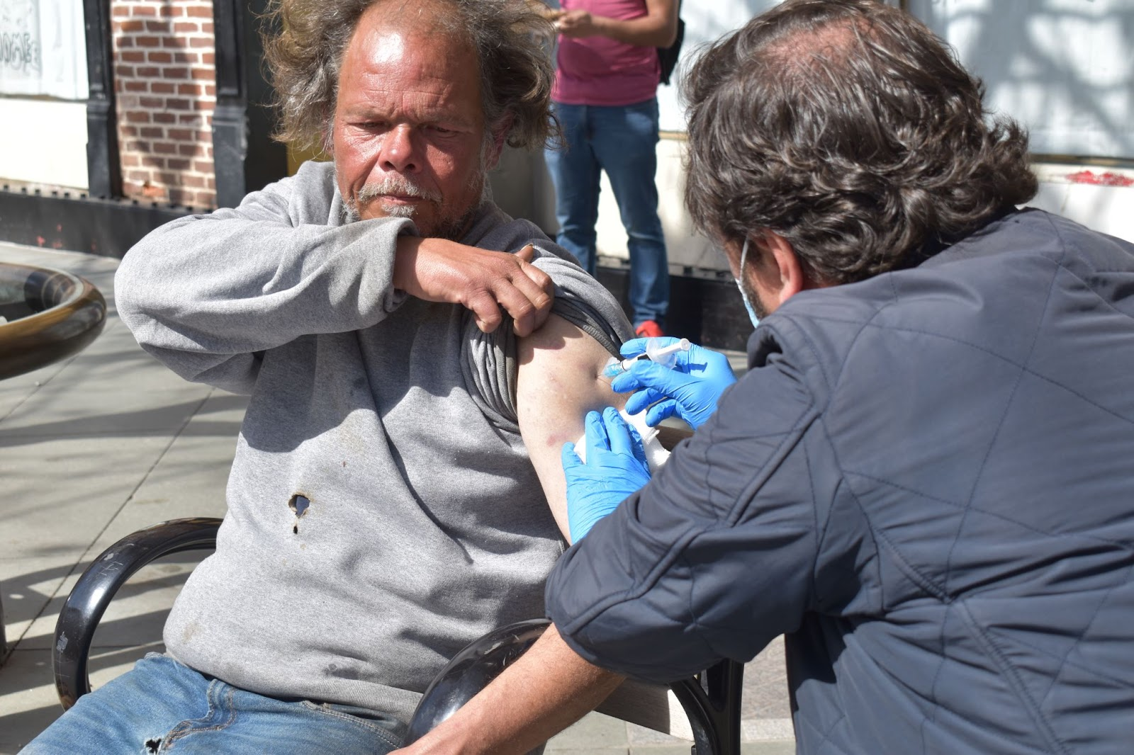 Dr. Brian Benjamin gives a dose of an injectable antipsychotic medication to a patient