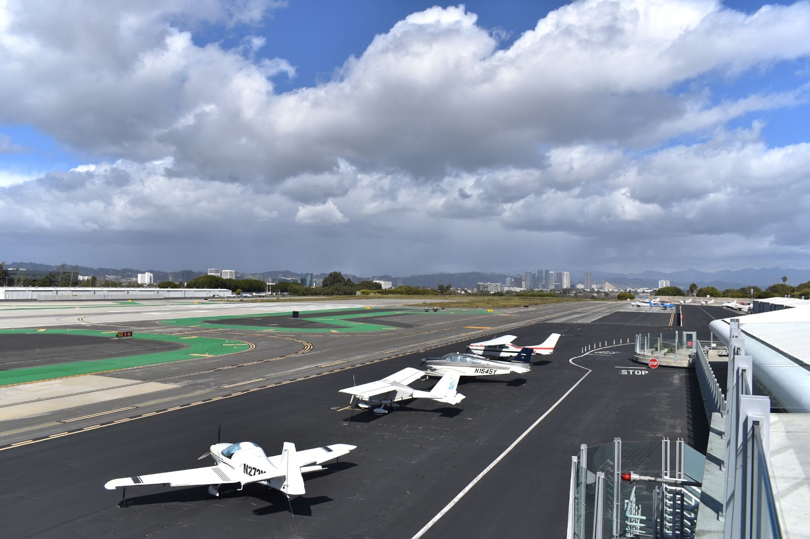 Looking north-east along Santa Monica Airport runway with Century City in the background