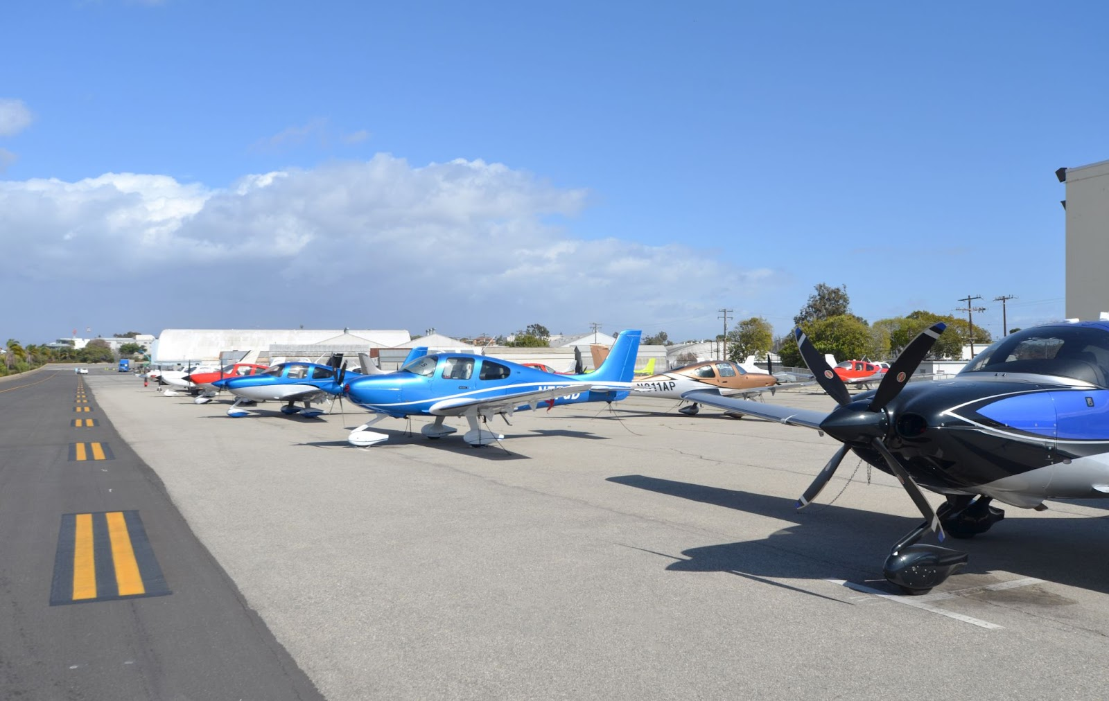 A row of privately-owned parked planes at Santa Monica Airport